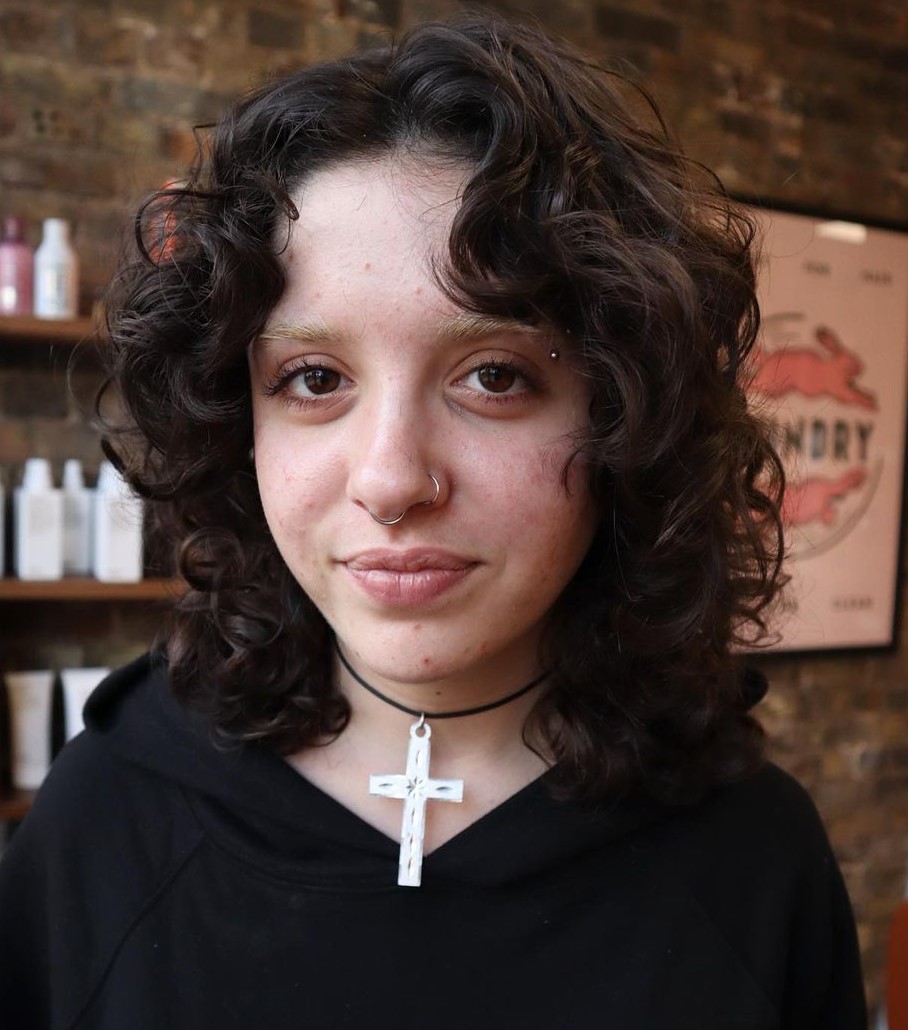 Wolf Haircut for Naturally Curly Hair Wolf Cut with Curtain Bangs for Wavy to Curly Hair