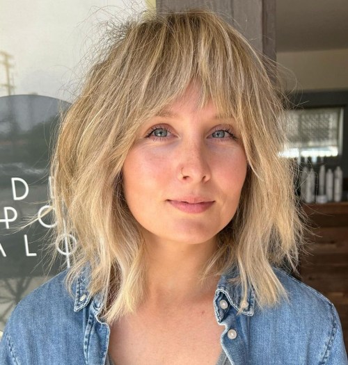 Textured Curtain Bangs on a Lob Wheat Blonde Bob with Soft Curtain Bangs