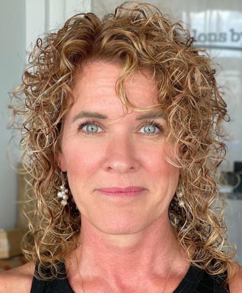 Permed Layered Cut Thin Shoulder Length Curls on Dark Blonde Hair