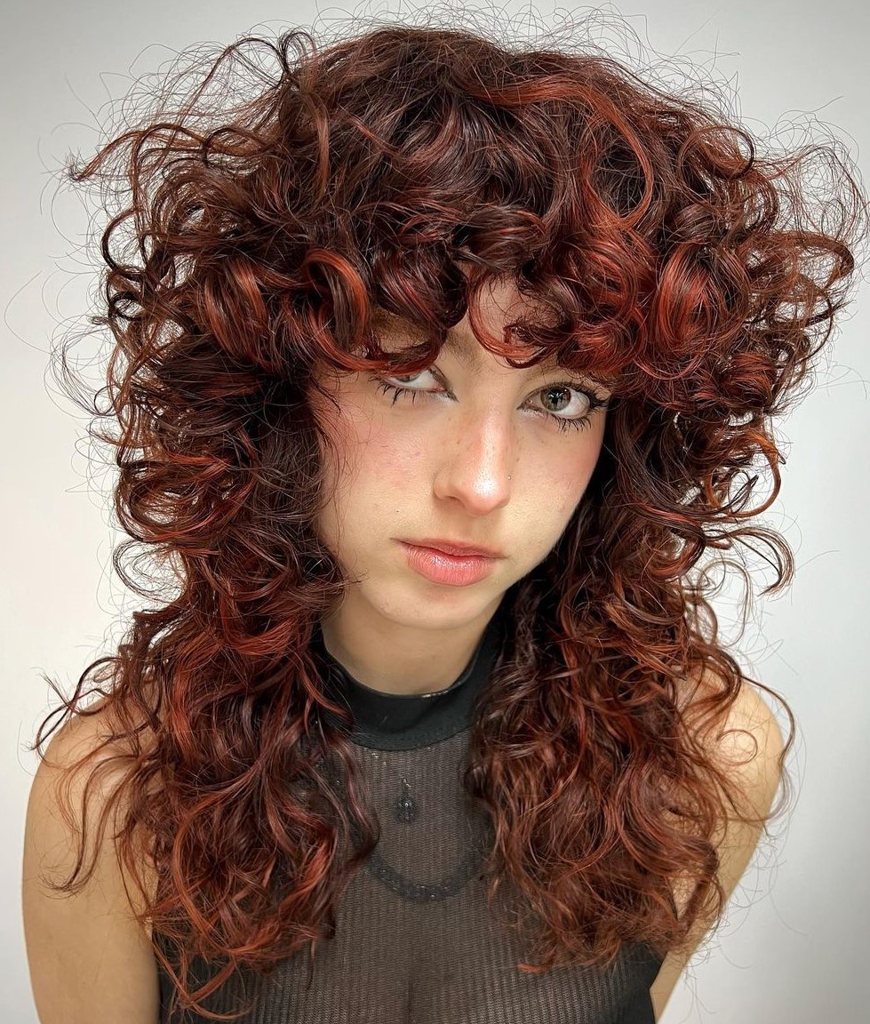 Dimensional Curly Wolf Haircut Heavily Layered Curly Red Hairstyle