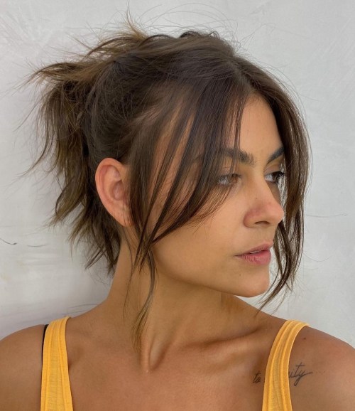Messy Ponytail with Long Curtain Bangs Messy Updo with Long Curtain Bangs
