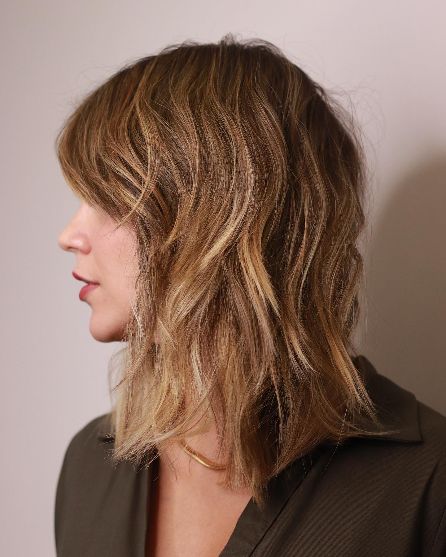 Mid Length Haircut with Bangs and Choppy Layers