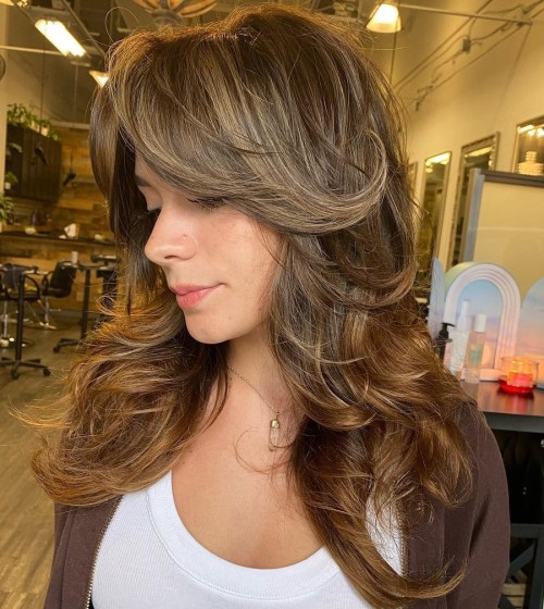 Classic Wolf Cut with Curly Bangs Flipped Ends and Teasylights on Wolf Cut