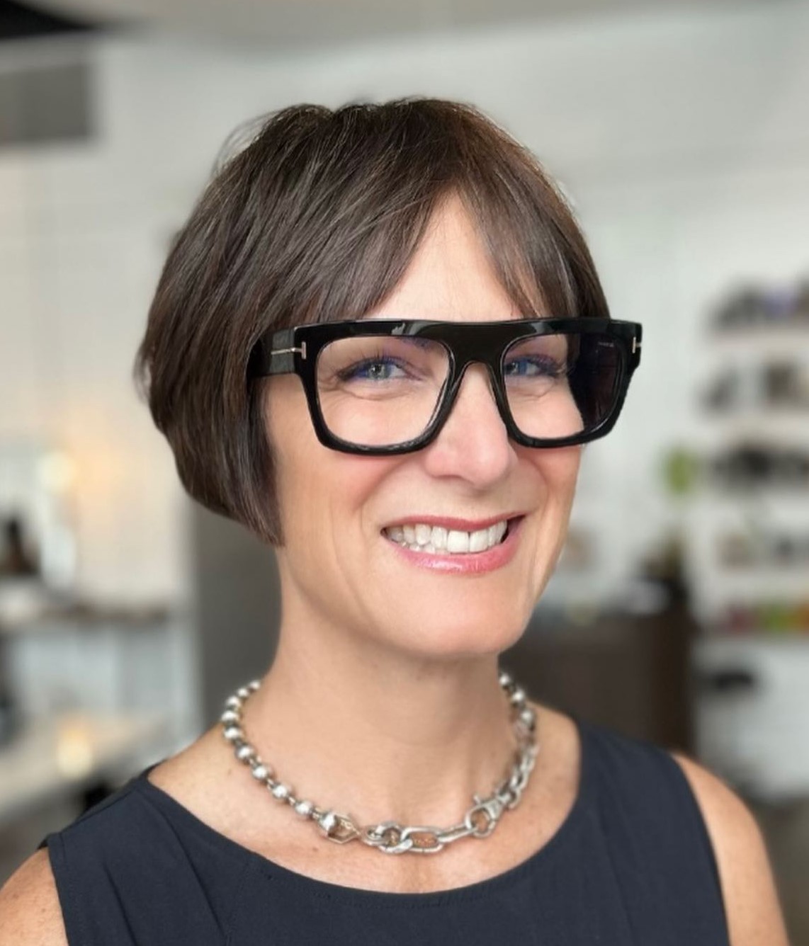 Short Hairstyle Paired with Statement Thick Frame Glasses