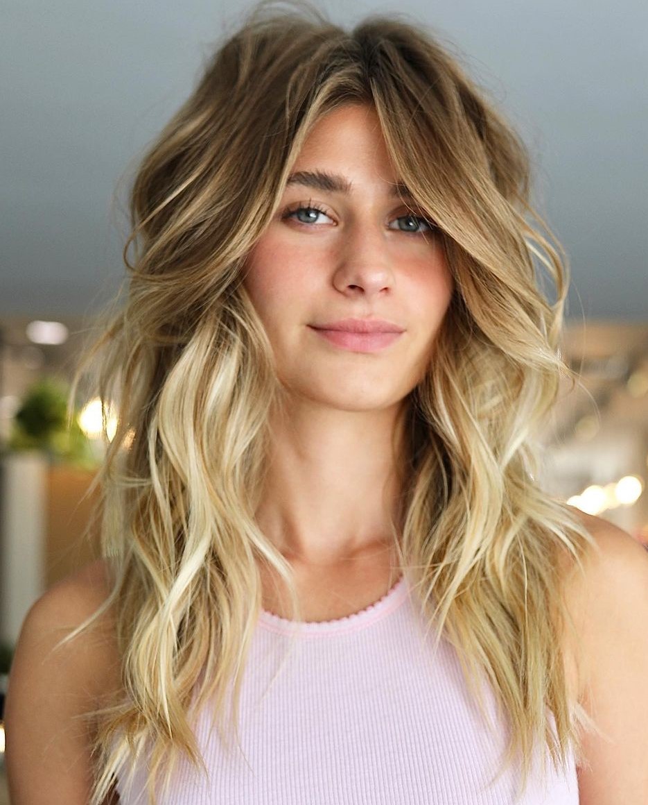 Blended Curtain Bangs with Layers Layers and Curtain Bangs on Long Blonde Wavy Hair