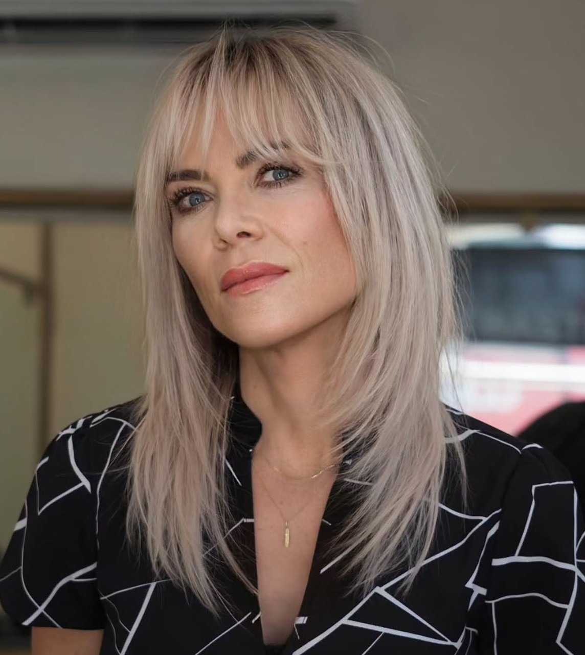 Over Wispy Bangs for a Big Forehead