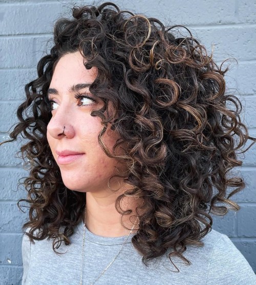 Lush Highlighted Curls Shoulder Length Layered Cut on Naturally Curly Hair
