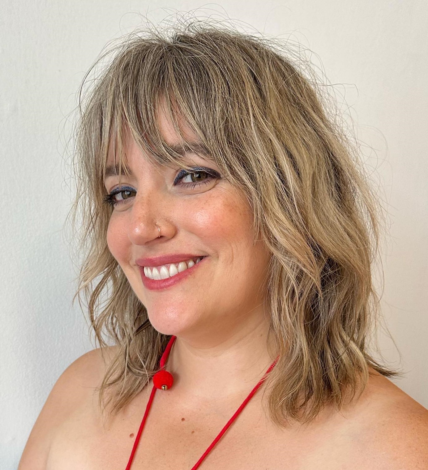 Medium Length Hairstyle with wispy Bangs