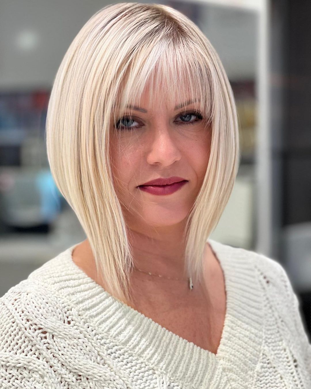 Blonde Angled Lob with a Thin Fringe Sleek Inverted Bob with Bangs