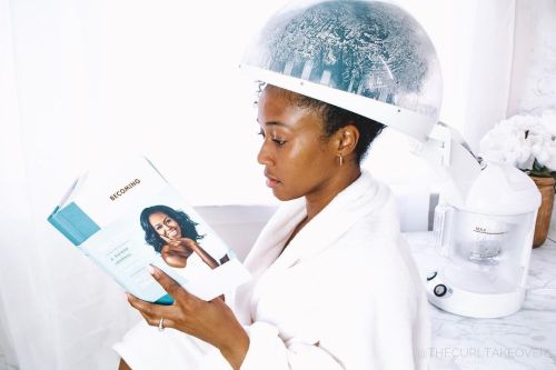 Woman Using a Home Hair Steamer