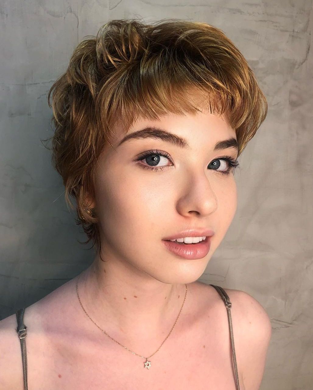 Flirty Blonde Layered Style for Short Hair Choppy Light Copper Pixie with Bangs